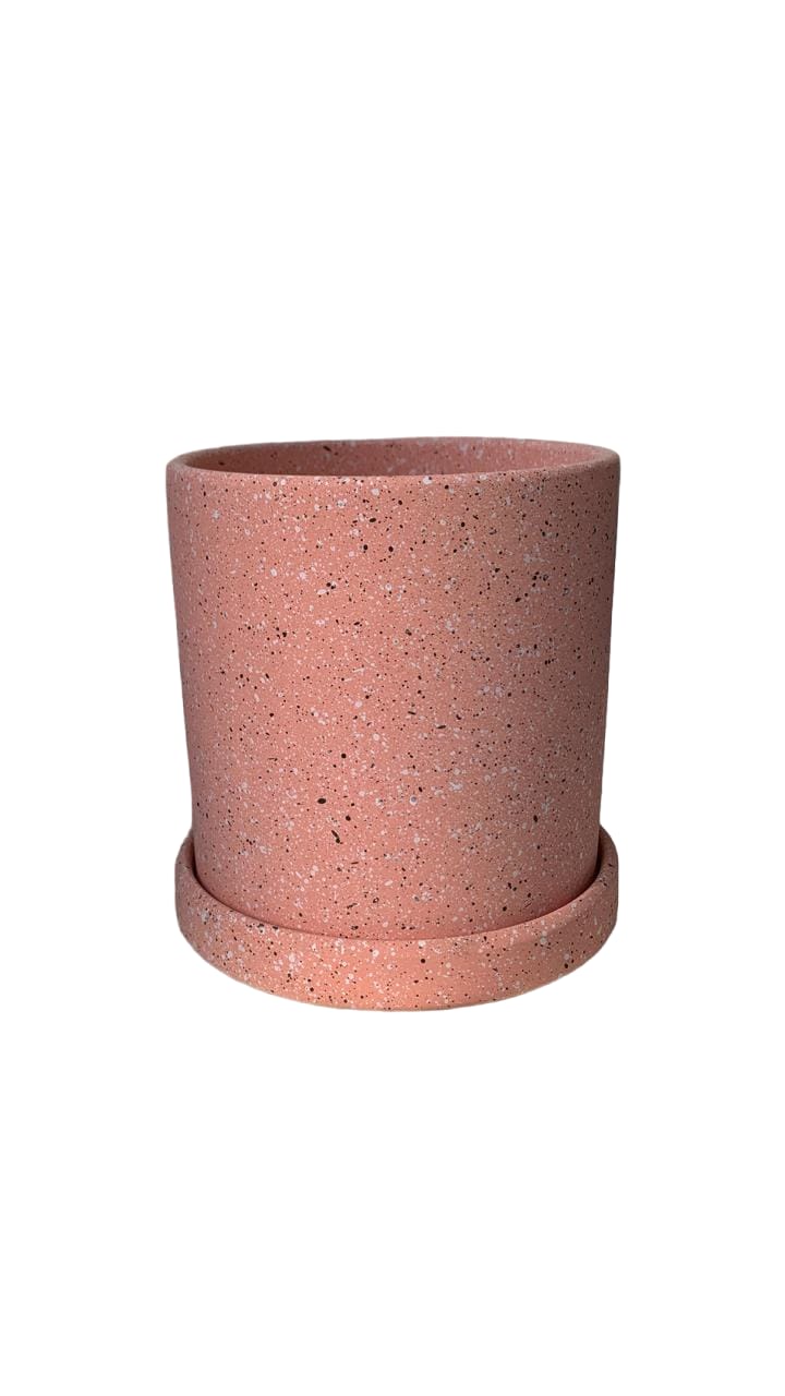 Pink speckled ceramic planter pot with matching saucer, ideal for indoor houseplants