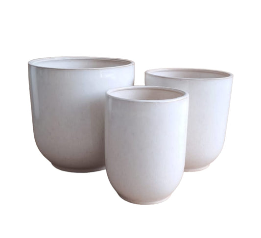 Set of three white ceramic plant pots in different sizes, minimalist design on white background