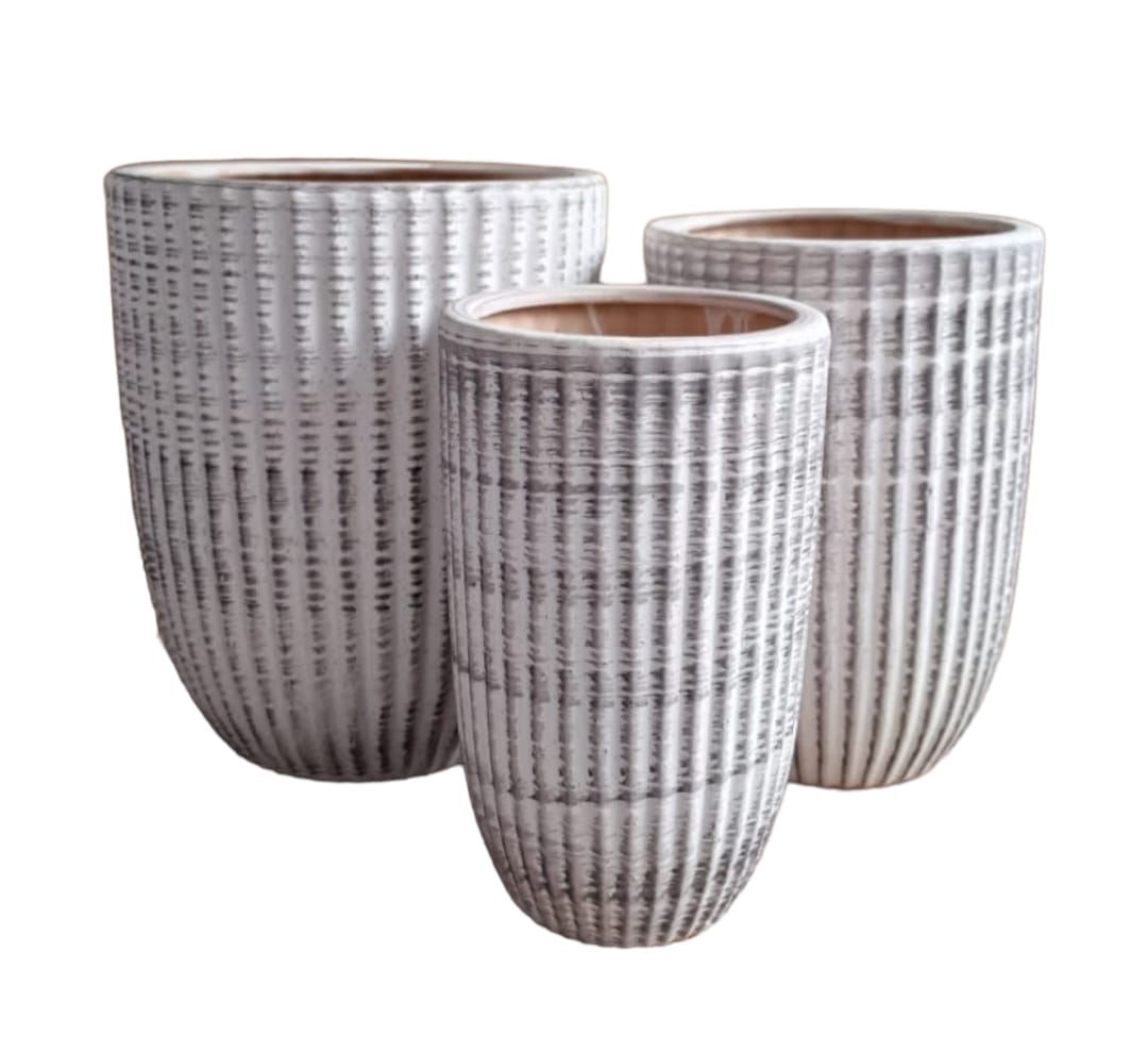 Set of three textured ceramic plant pots in white and grey, modern vertical striped design