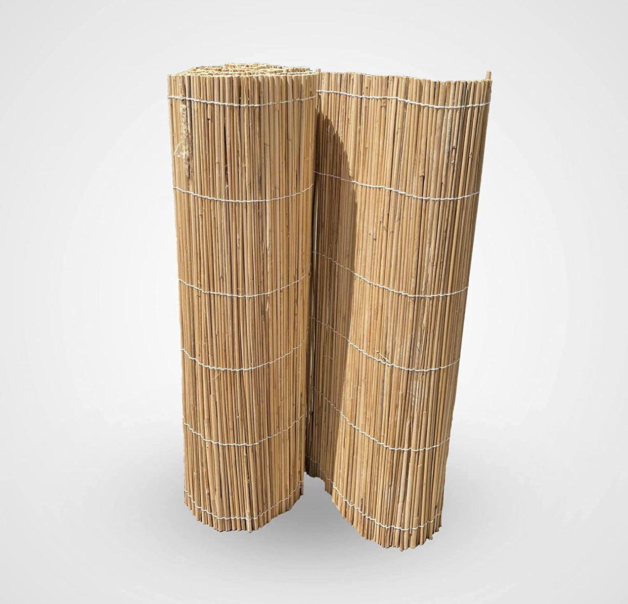 Rolled natural bamboo garden fence panel on white background