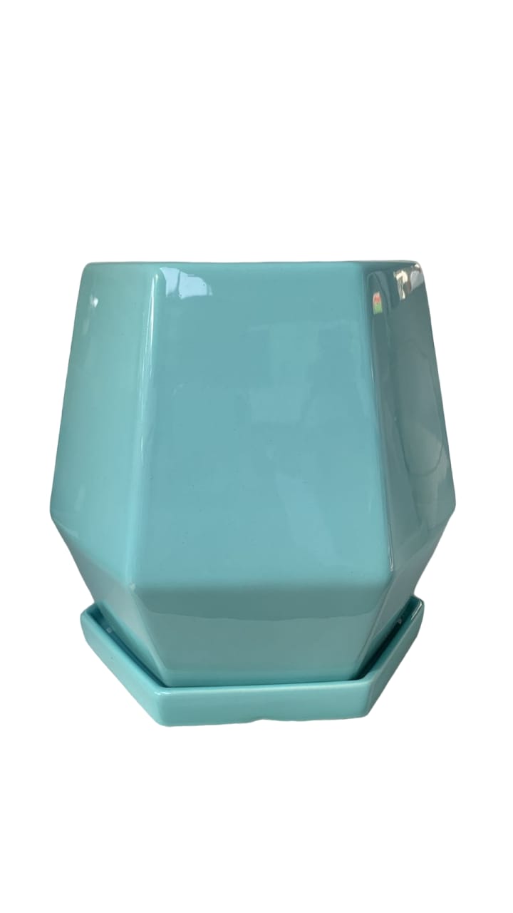 Turquoise geometric ceramic plant pot with matching saucer, ideal for indoor plants.