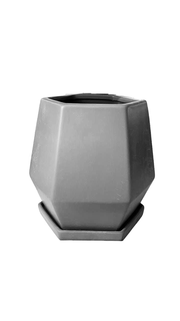 Modern geometric gray plant pot with matching saucer on white background