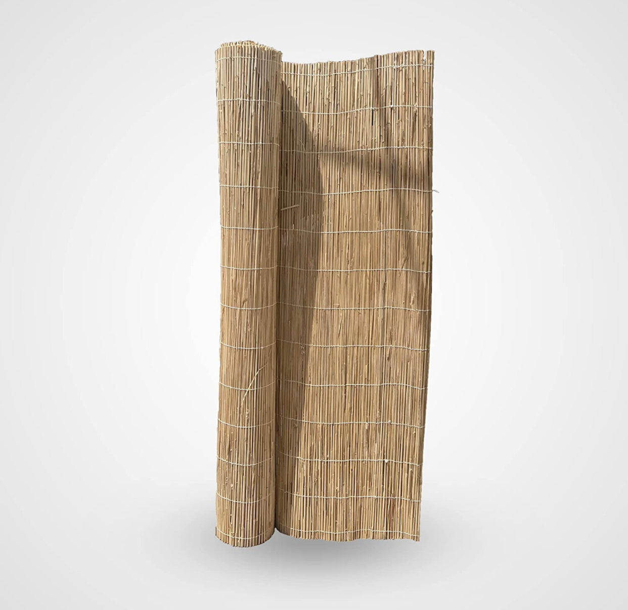 Rolled natural bamboo garden fence panel with horizontal wire ties on white background
