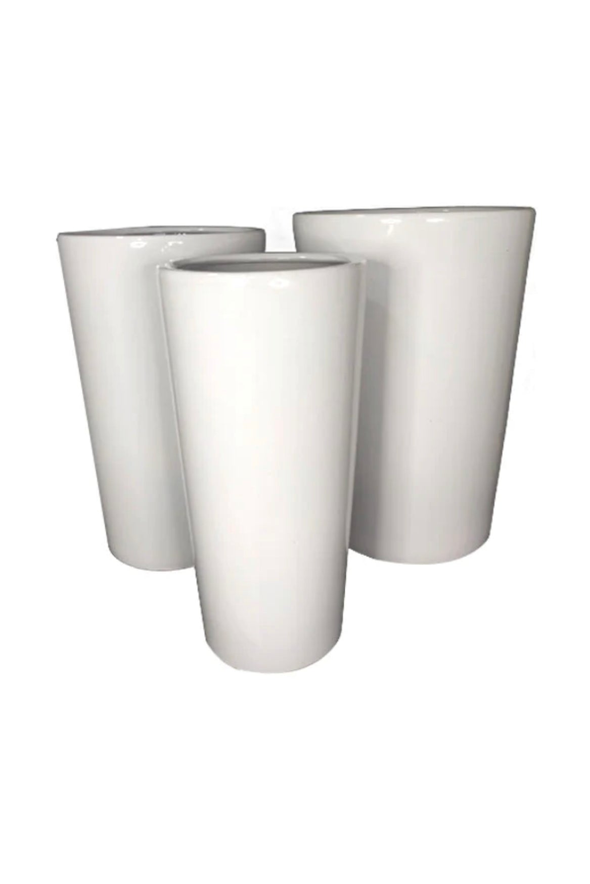 Set of three tall white ceramic planters with glossy finish on white background