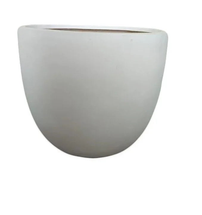 Minimalist white ceramic planter pot with rounded shape on plain background
