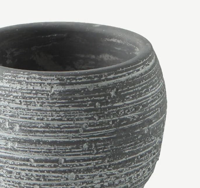 Textured grey fiber cement plant pot with round shape and horizontal lines