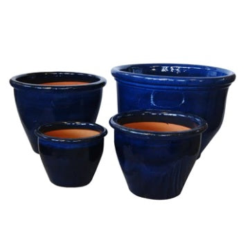 Set of four round blue ceramic plant pots with glossy finish, various sizes
