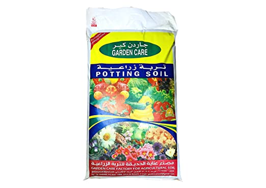 Bag of potting soil with fruits and flowers, labeled Garden Care, for gardening and planting.